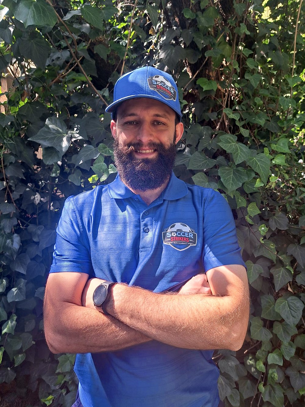 Jaen van der Walt, founder of Soccer Strikers, in his Soccer Strikers shirt and cap